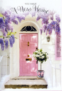 In this image, the entrance to a South Hackney home has been transformed into a soft, floral vignette that feels both modern and timeless, like something glimpsed while wandering the streets between Mare Street and Well Street Common. A painted pink door anchors the composition, its smooth surface and simple panels bathed in gentle, natural light. The shade is delicate, almost chalky, and it stands out softly against the crisp white walls that surround it, where faint textures catch the sunlight and create subtle variations in tone. Above and along the top of the frame, rich clusters of wisteria cascade downward, their small, lavender-hued blooms gathered into loose, pendulous sprays. These floral curtains create a semi-arched canopy over the doorway, as if nature itself were offering a fragrant blessing on the new home. Resting on the step, right at the threshold, is a chic grey tin bucket that has been repurposed into a welcoming vessel for a generous bouquet of white and cream roses. The roses look freshly cut, with petals that appear soft and full, each bloom nestling into the next so that the arrangement feels lush and abundant. Interspersed among the roses are sprigs of fresh green foliage, their leaves adding structure and a subtle movement that keeps the bouquet from feeling too formal. Tied around the base of the bucket is a soft pink ribbon, its ends trailing just enough to suggest an easy, relaxed elegance. The overall atmosphere suggests hope, pride, and that first deep breath one takes when stepping over the threshold of a South Hackney flat or townhouse for the very first time, greeted by flowers that speak of warmth, welcome, and simple joy.
