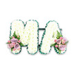 This image shows a personalised floral tribute spelling out "MA" in large, capital letters, a design often chosen to honour a much-loved mum or mama in South Hackney and beyond. Both letters are mounted on a shared base and are completely filled with a dense covering of white chrysanthemums. The tiny blooms sit shoulder to shoulder, creating a continuous blanket of petals that looks soft and cloud-like, yet holds a strong, defined shape. The crisp whiteness of the chrysanthemums gives an impression of serenity and respect, while their feathery texture adds a gentle, comforting quality. Tracing the outer edges of the "M" and the "A" is a slim border of rich, dark green-either ruffled ribbon or neatly arranged foliage-carefully pleated to follow every point and curve. This outline frames the letters beautifully, offering a striking contrast and ensuring the tribute remains clearly legible from across a church or crematorium hall, perhaps in a setting close to London Fields or Victoria Park Village. At the lower left side of the "M" and the lower right side of the "A", two matching floral sprays bring in subtle yet meaningful colour. These clusters feature soft-pink roses and lilac-toned roses, interspersed with smaller pink spray roses whose buds and mini blooms create additional texture. Light, airy fern fronds extend from behind the roses, adding a relaxed, natural feel. The entire arrangement is photographed against a plain white background, focusing attention on the careful craftsmanship and thoughtful balance of colour and form. This "MA" letter tribute feels tender and deeply personal, an elegant way for a South Hackney family to express love, remembrance, and gratitude at a final farewell.